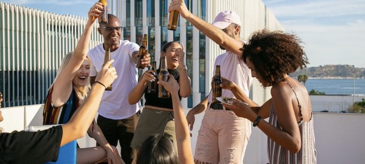  a happy group of friends holding drinks and Couples Experience